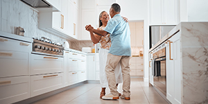 Couple dancing in a kitchen 
