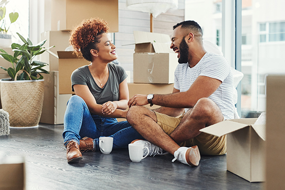 Couple sitting on the floor in a new home