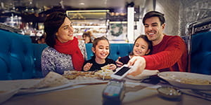A family sitting together at a restaurant 