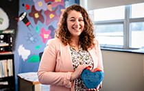 A Citadel Heart of Learning Award winner holding the award