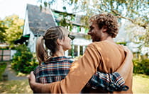 Couple looking at their home