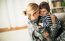 Veteran mother holding her child