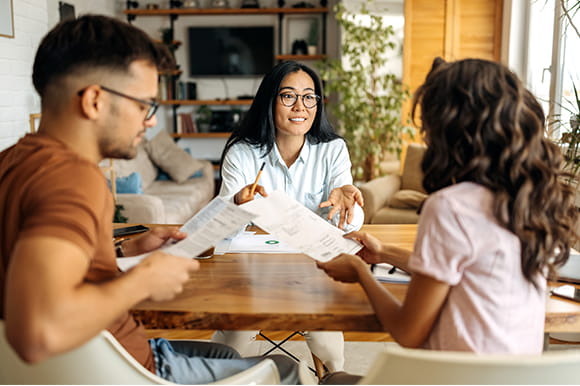 A young couple meeting with an advisor