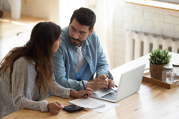 Couple working at a computer 