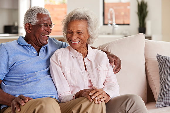 Couple sitting together on a couch