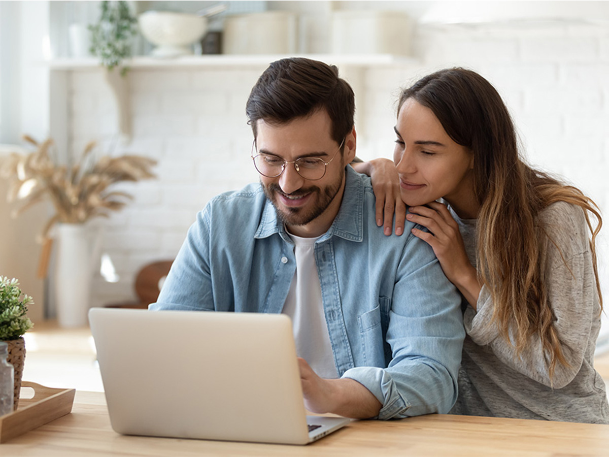 Couple working at a laptop