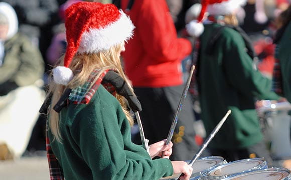 person drumming in santa hat