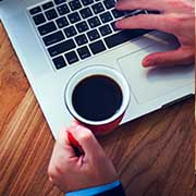 job change, career change, hand with coffee mug near computer