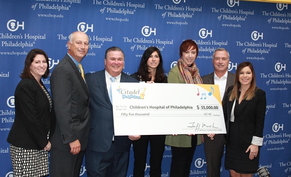 Citadel presents CHOP with $55,000 check. 